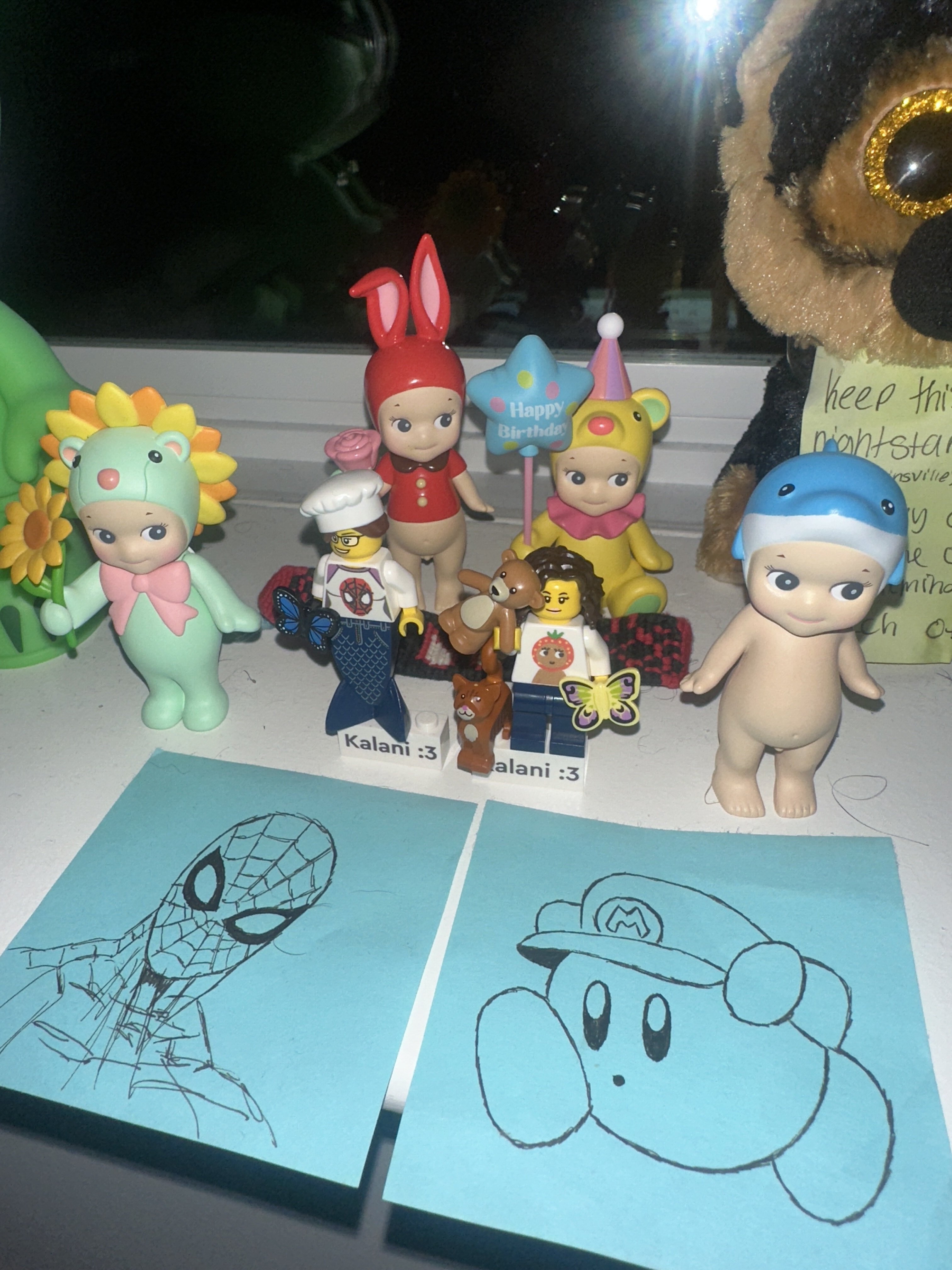 Cloud plushies chilling beside the sticker binder.