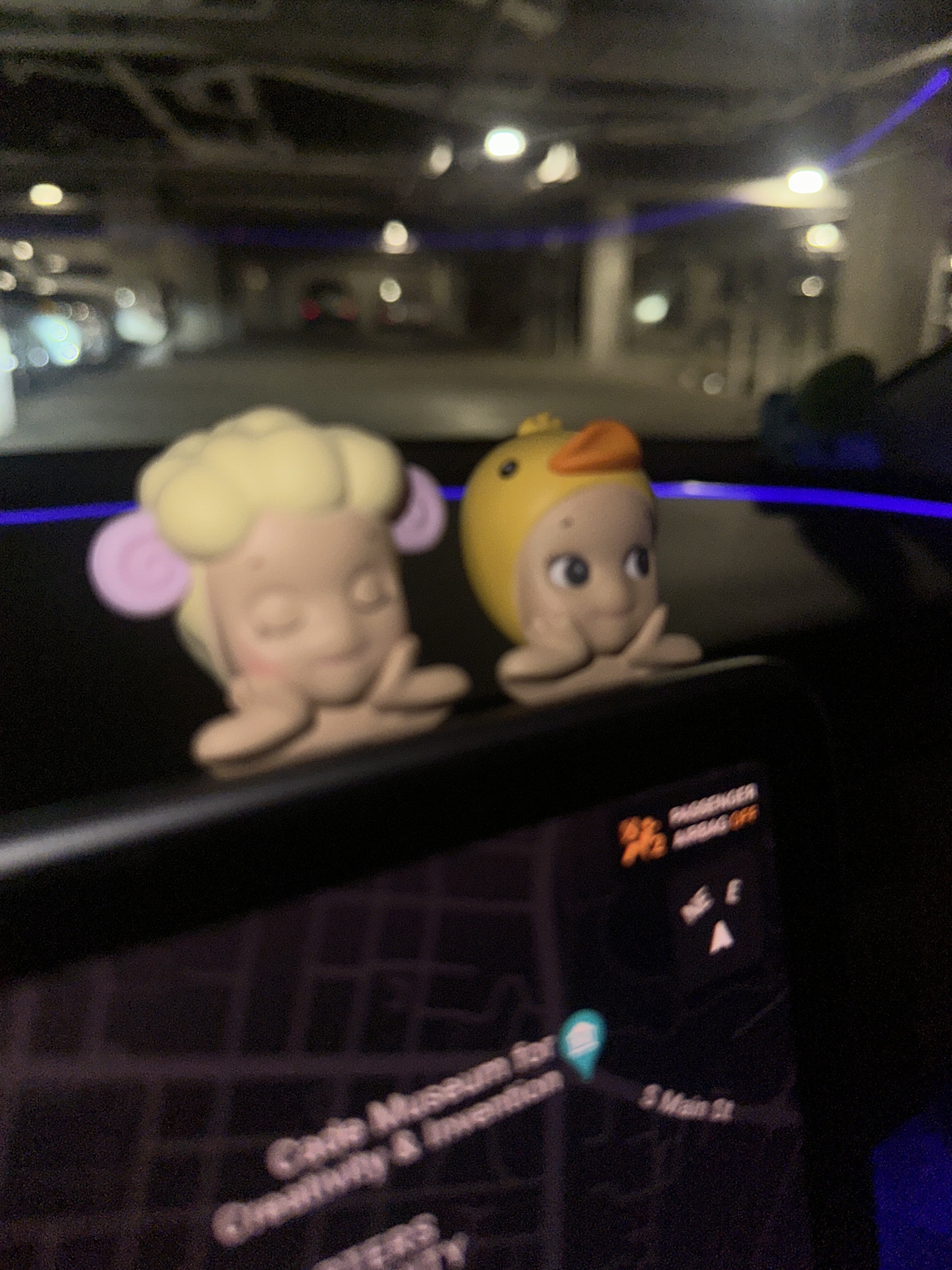 Every charm pinned to the cork board in rainbow order.